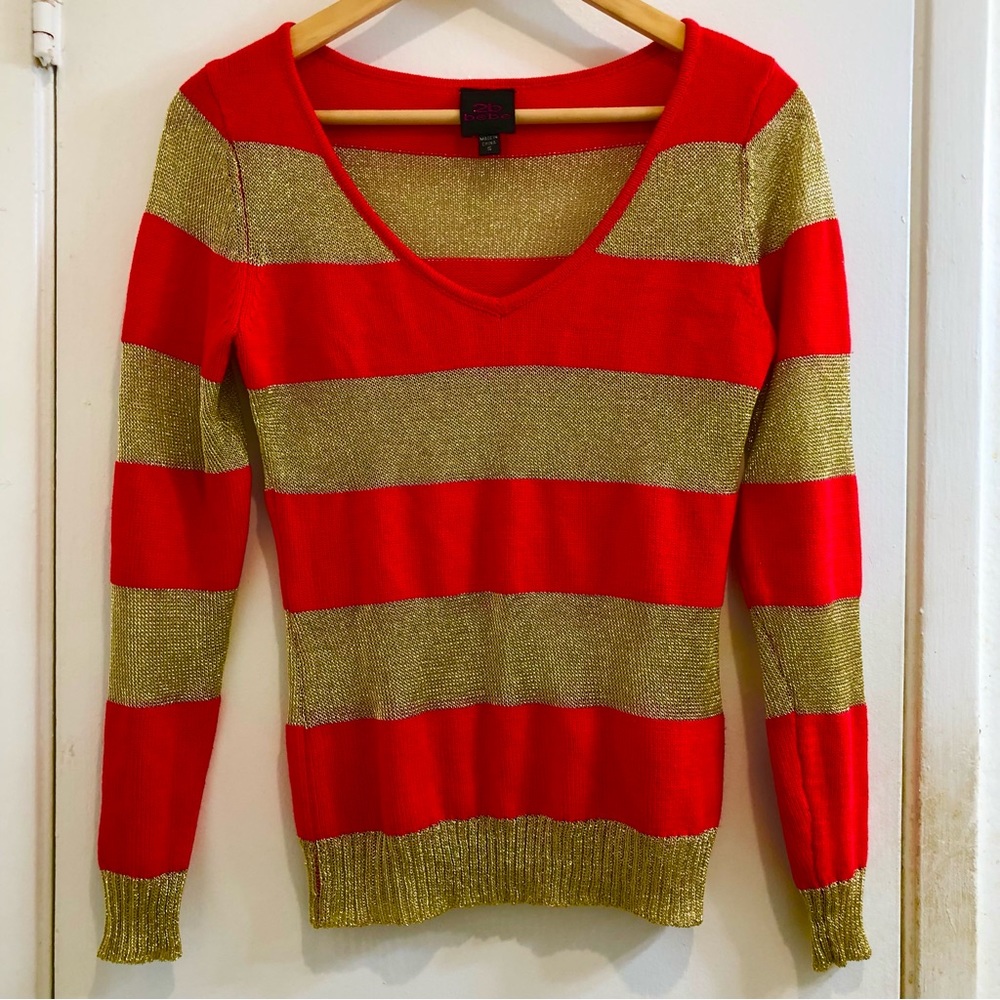 Bebe 2B Pull-Over V-Neck Sweater. Red/Metallic Gold Size Small. New Condition.